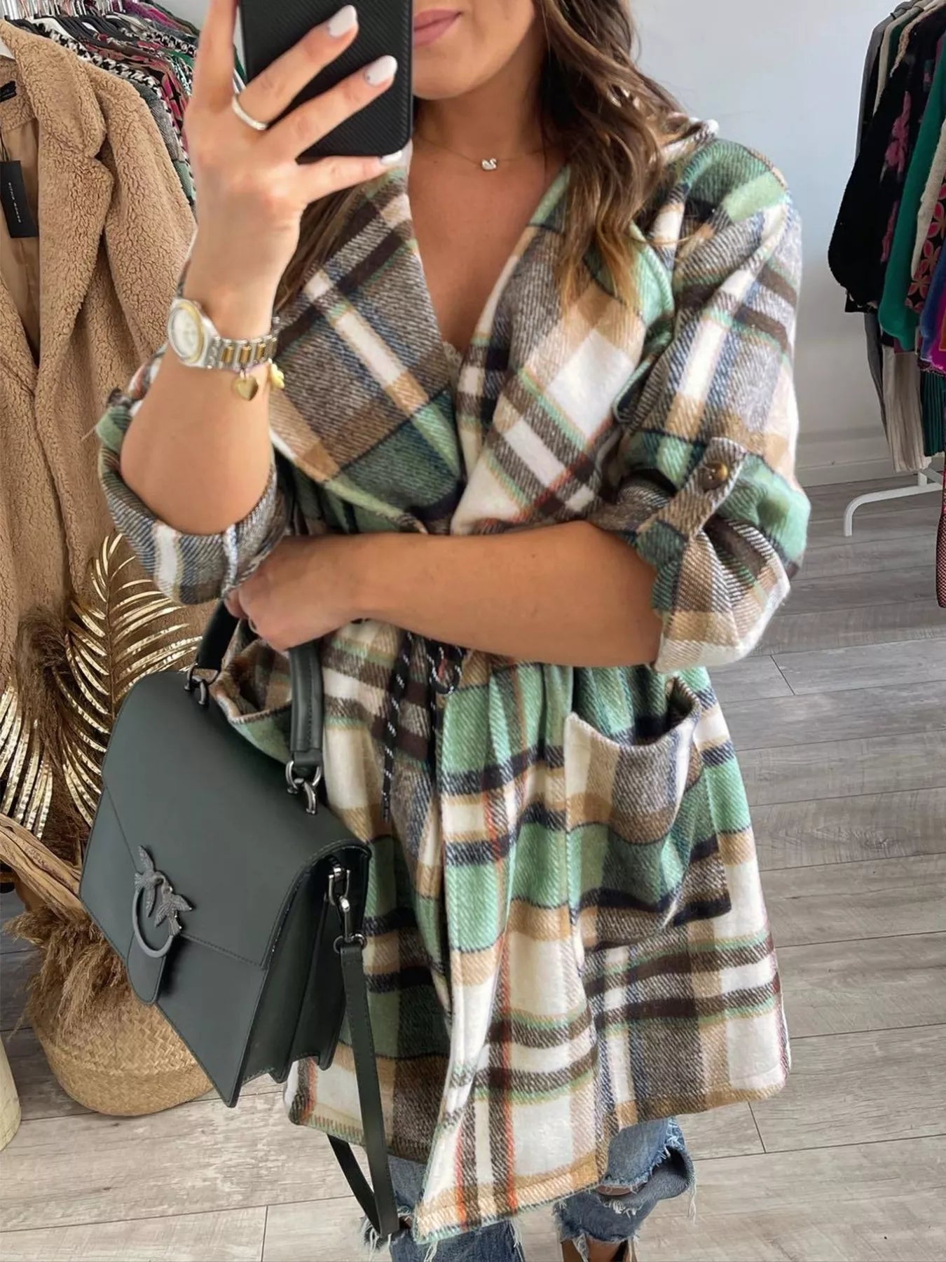 Green and beige plaid belted coat with front pockets, made of soft flannel fabric.