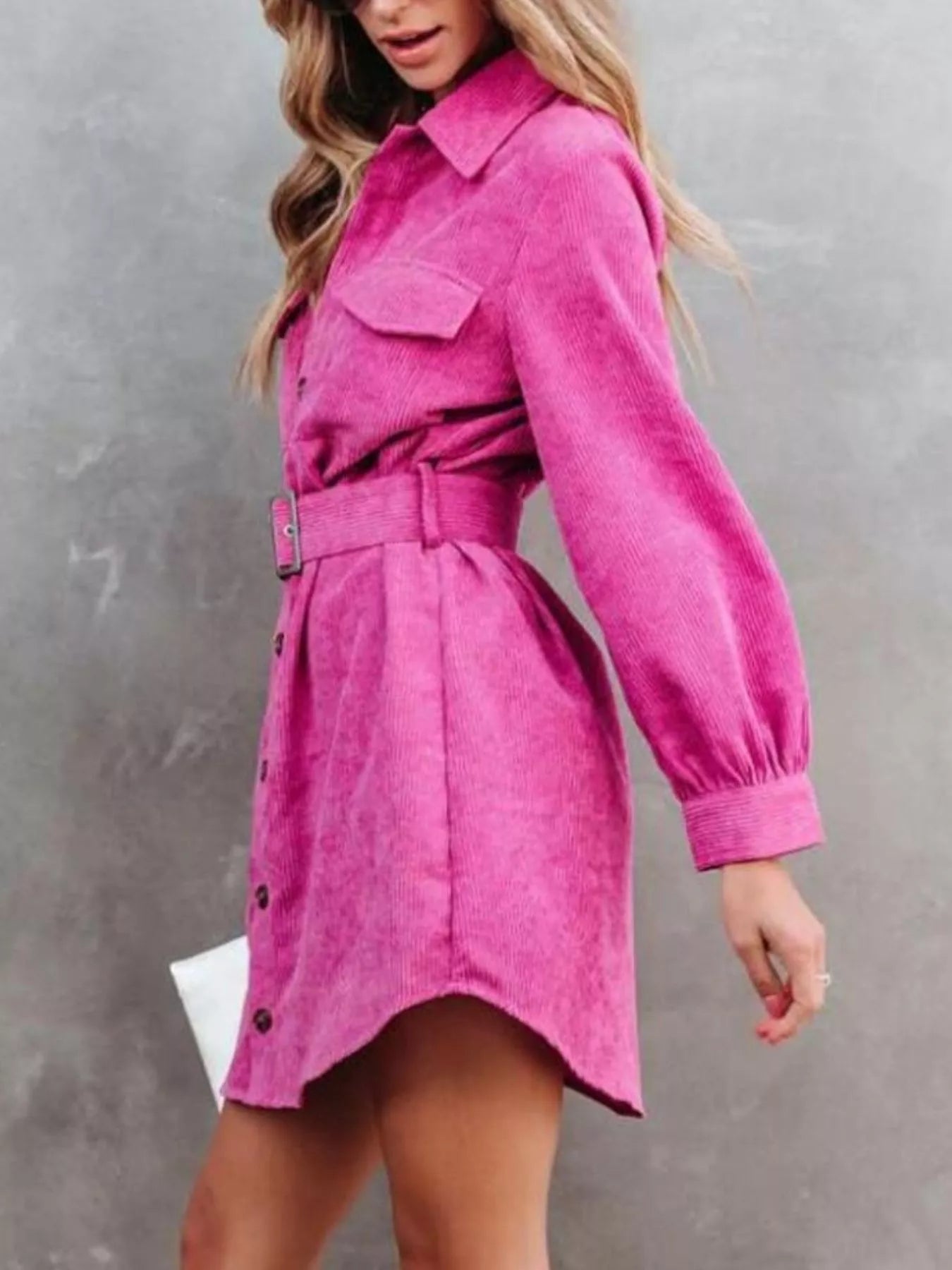 Pink corduroy shirt dress with belt and button front detailing.