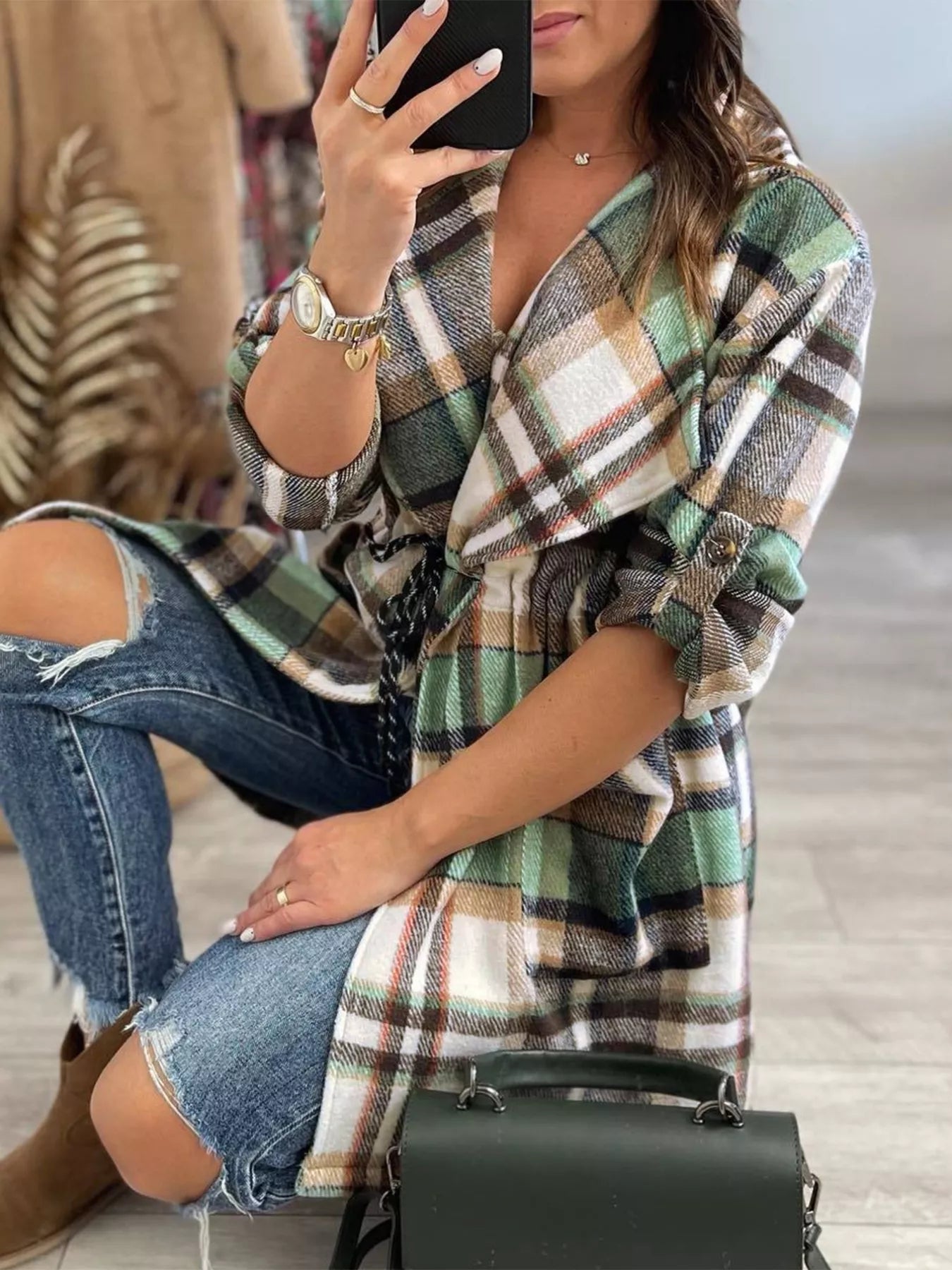 Plaid Flannel Cardigan in green, brown, and white with rolled sleeves and a belted waist.