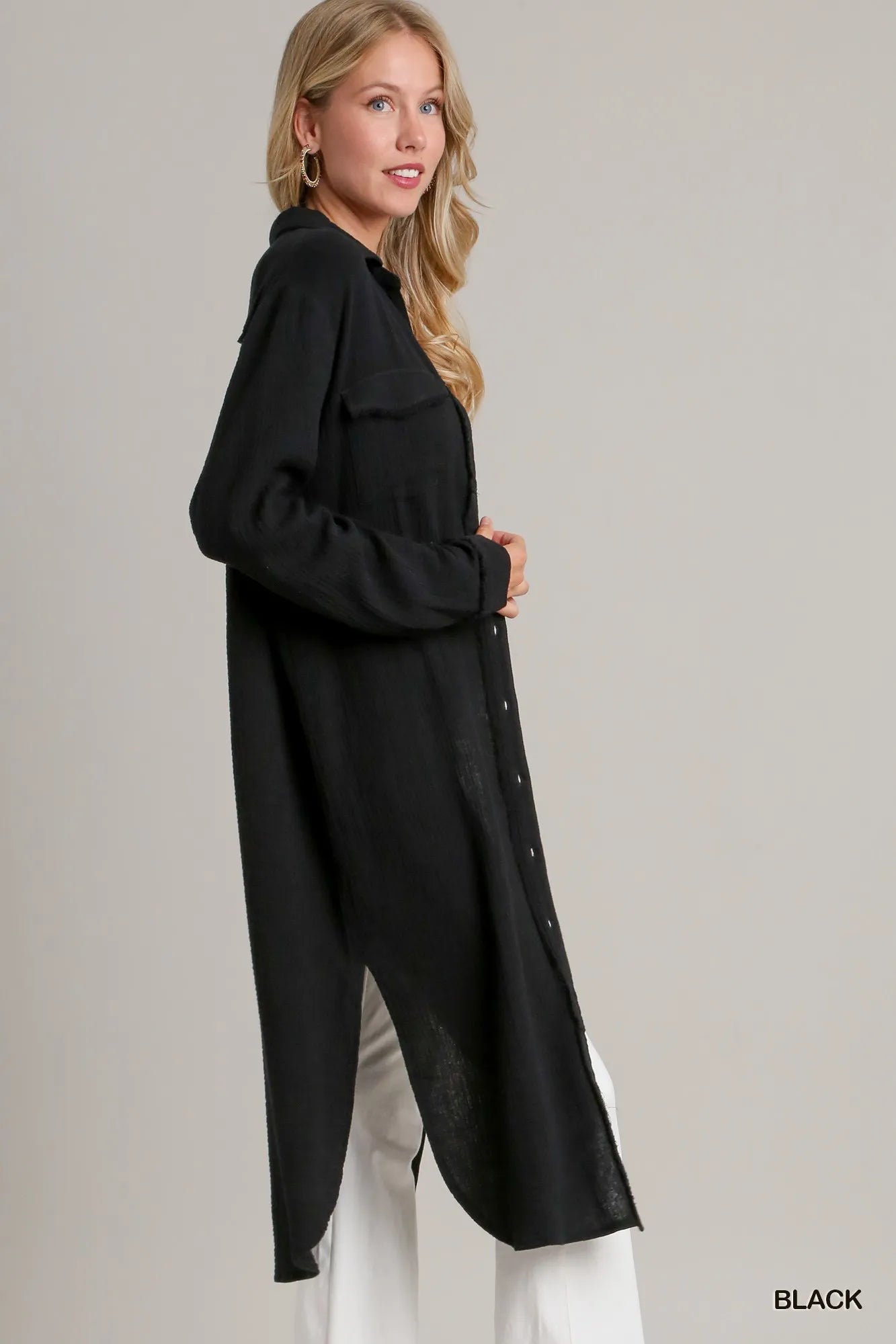 Black Freya Shirt Dress, long black button-down with chest pocket, made from lightweight crinkled fabric.