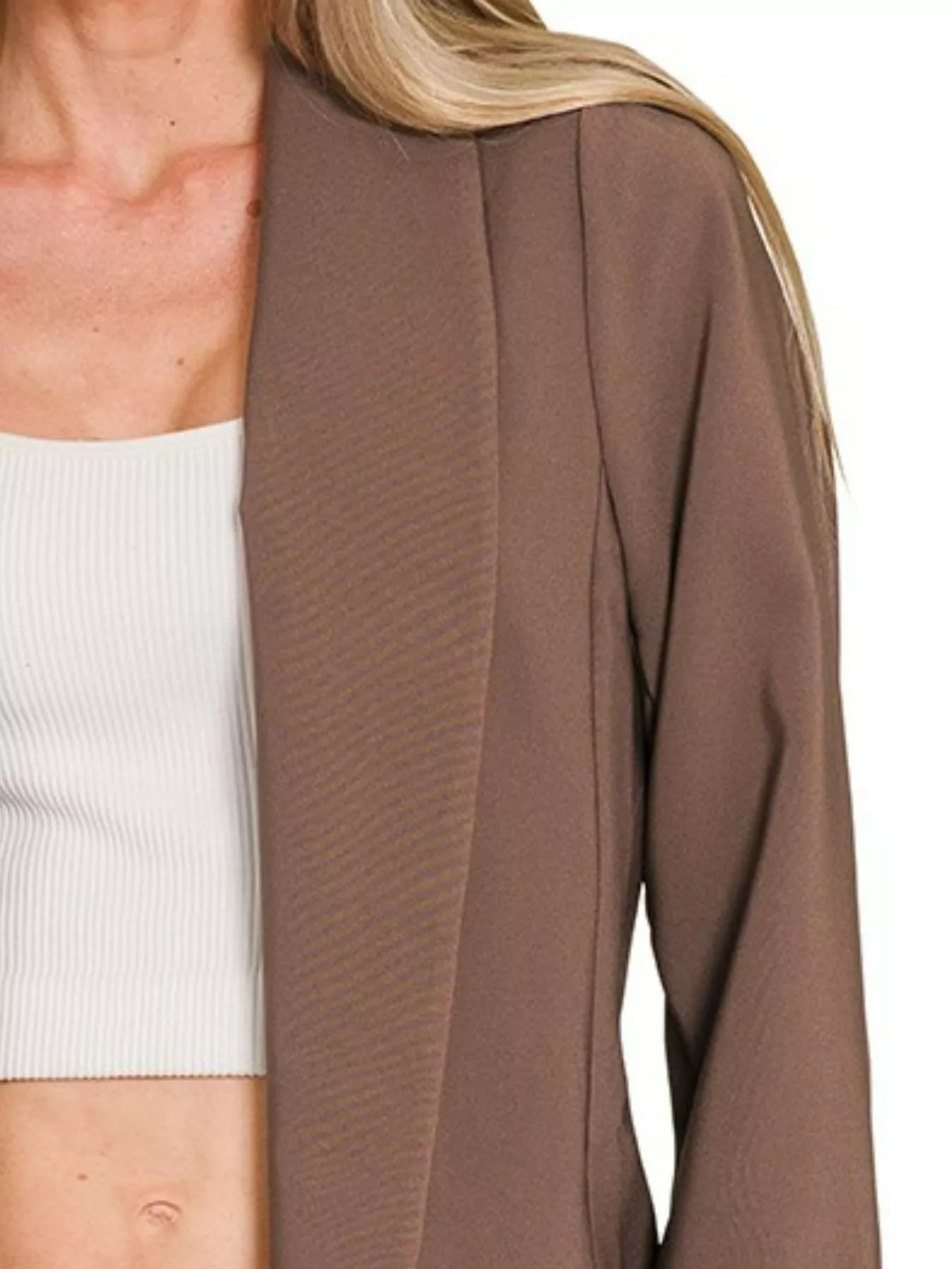Brown open-front blazer, long-sleeve, made from lightweight woven fabric.