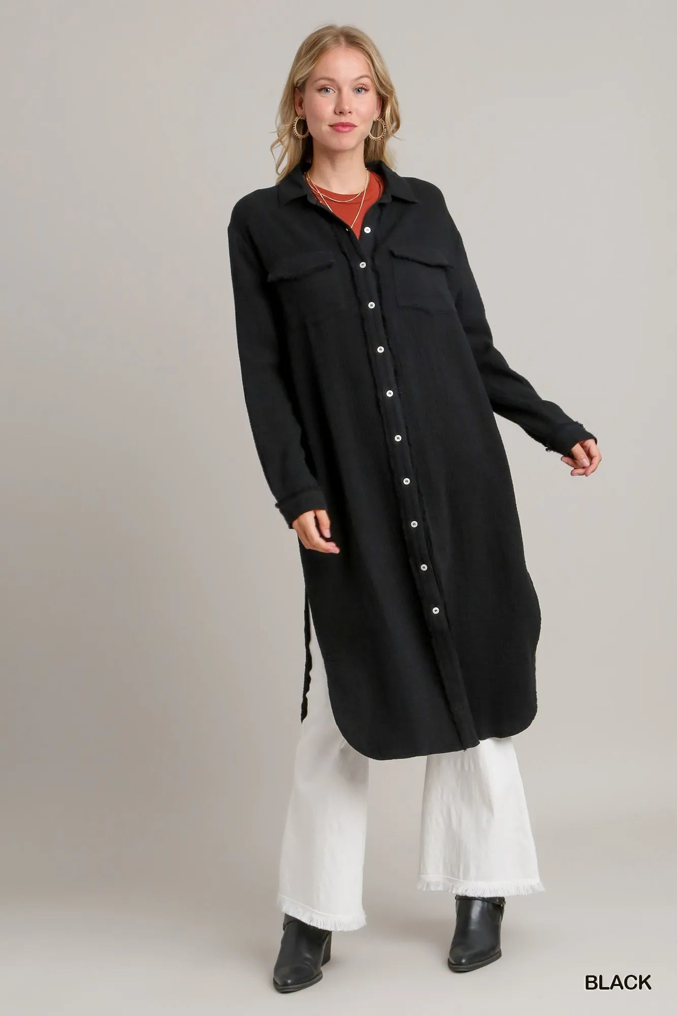 Black button-up midi shirt dress with chest pockets, made of soft gauze fabric.