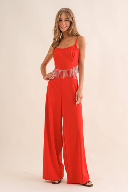 Red Glam Jumpsuit with rhinestone belt detail, wide-leg style and spaghetti straps.