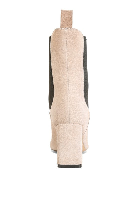 Beige suede ankle boot with black side panels and a chunky block heel.