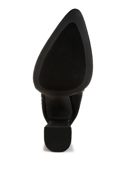 Black pointed-toe boot with rubber sole and block heel for added traction