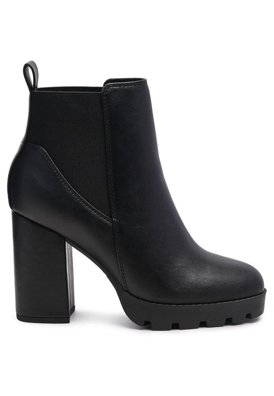 Black ankle boot, chunky heel, faux leather, with elastic side panels for easy pull-on.