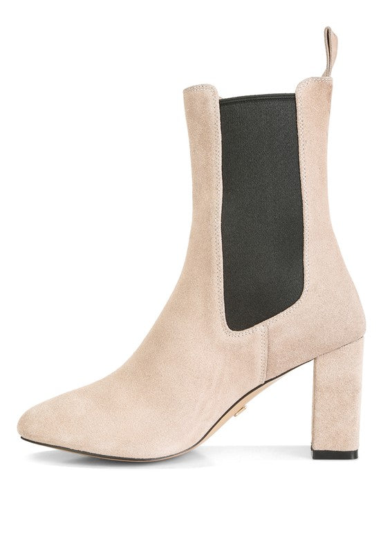 Beige suede Chelsea boot with block heel and black elastic side panel.