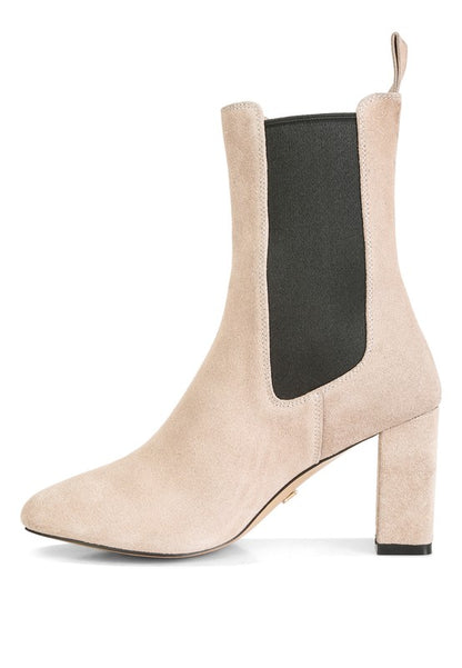 Beige suede Chelsea boot with block heel and black elastic side panel.