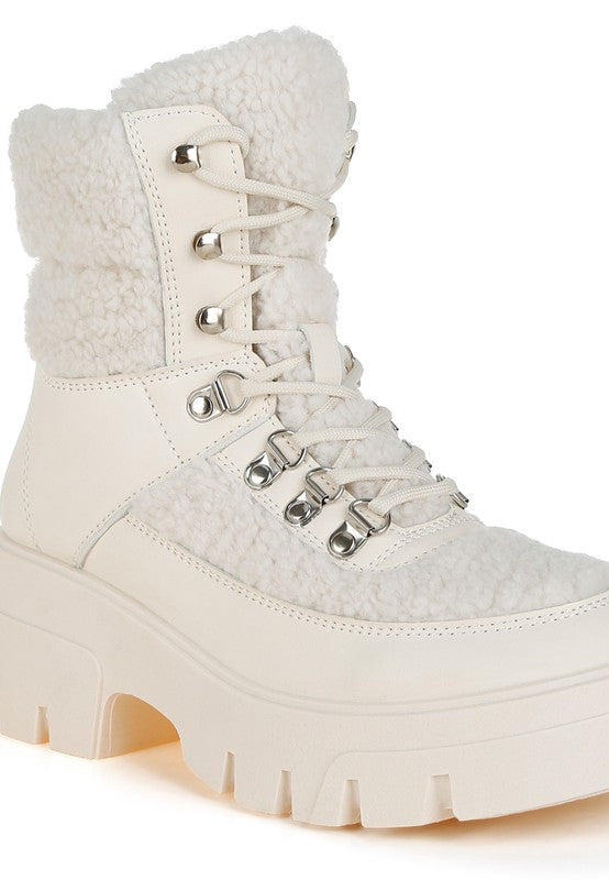 Lace-Up Sherpa Boot in ivory, featuring a chunky sole and soft fleece lining for warmth.