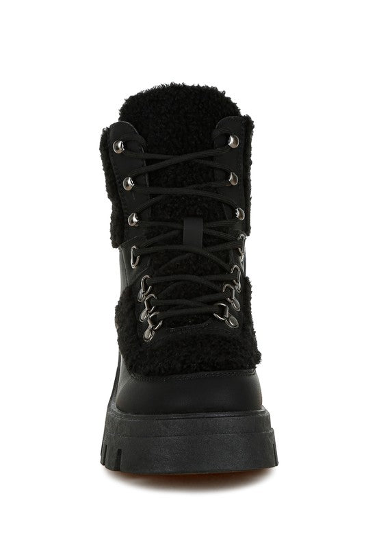 Maya Black Lace-Up Boot with faux shearling trim and rugged rubber sole.