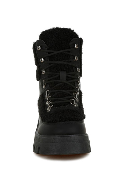 Maya Black Lace-Up Boot with faux shearling trim and rugged rubber sole.