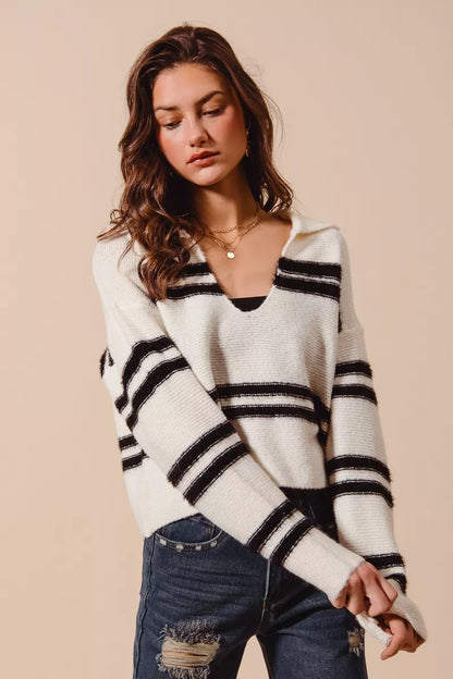 Ivory and black striped sweater with collar, soft knit fabric.