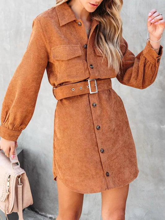 Rust corduroy belted shirt dress with button front and chest pockets.