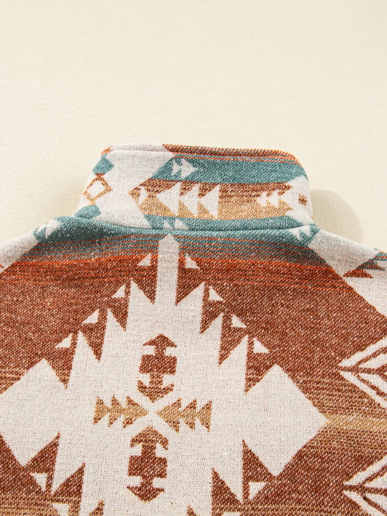 Aztec Fleece Pullover in multicolor with high collar and soft woven texture.