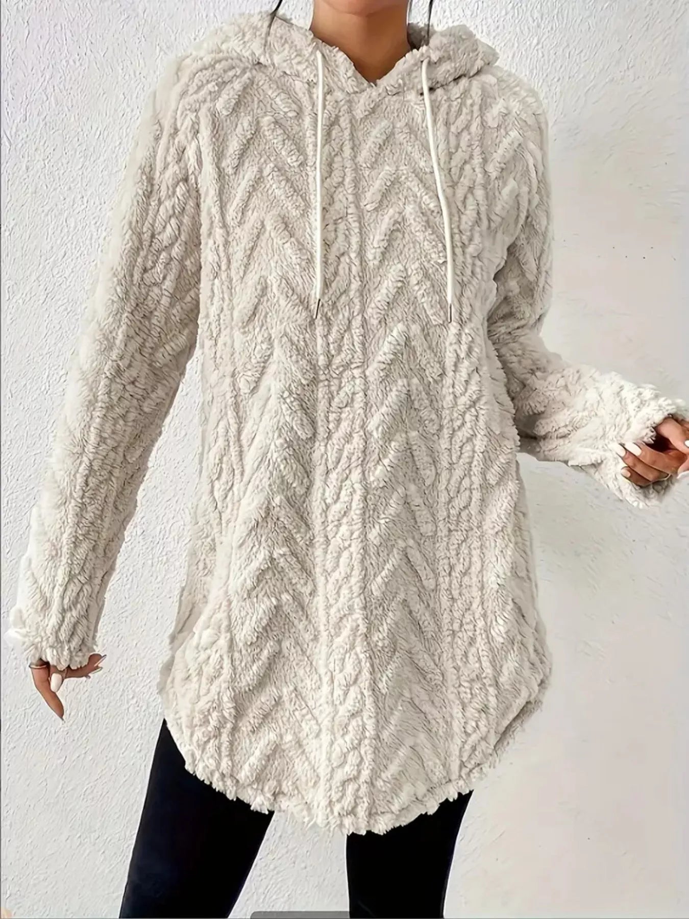 Ivory hooded pullover sweater in faux fur with chevron texture pattern.