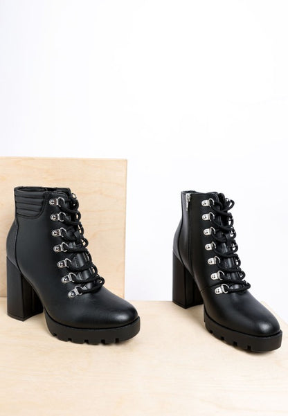 Black lace-up ankle boots with chunky heels and faux leather finish.
