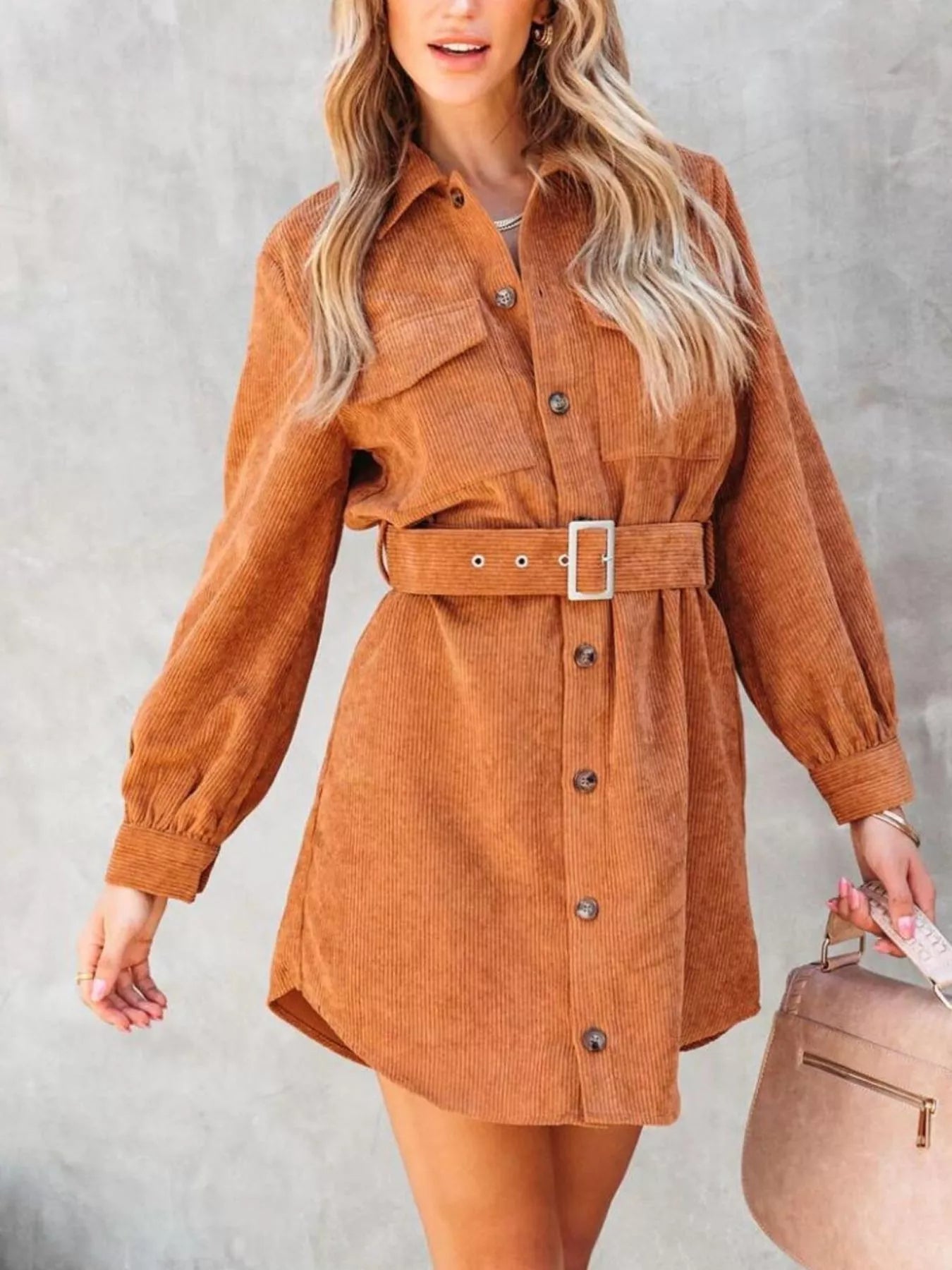 Rust corduroy shirt dress with belt and front buttons.