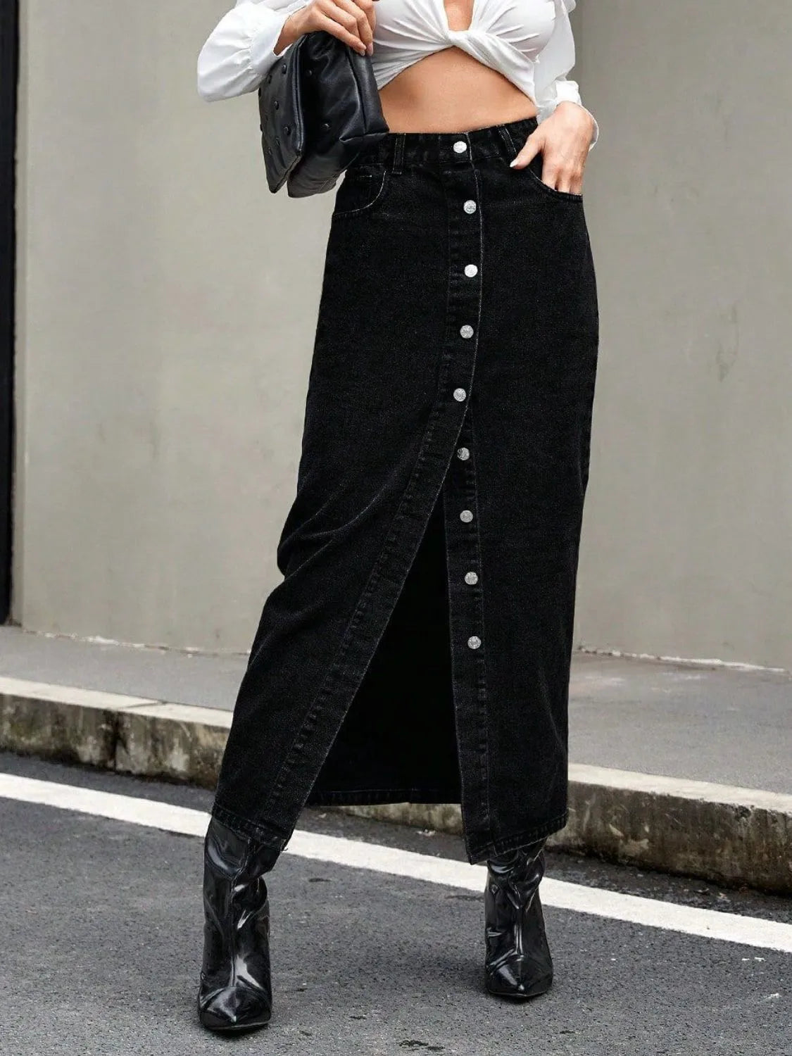 Black denim maxi skirt with front button closure and high waist design