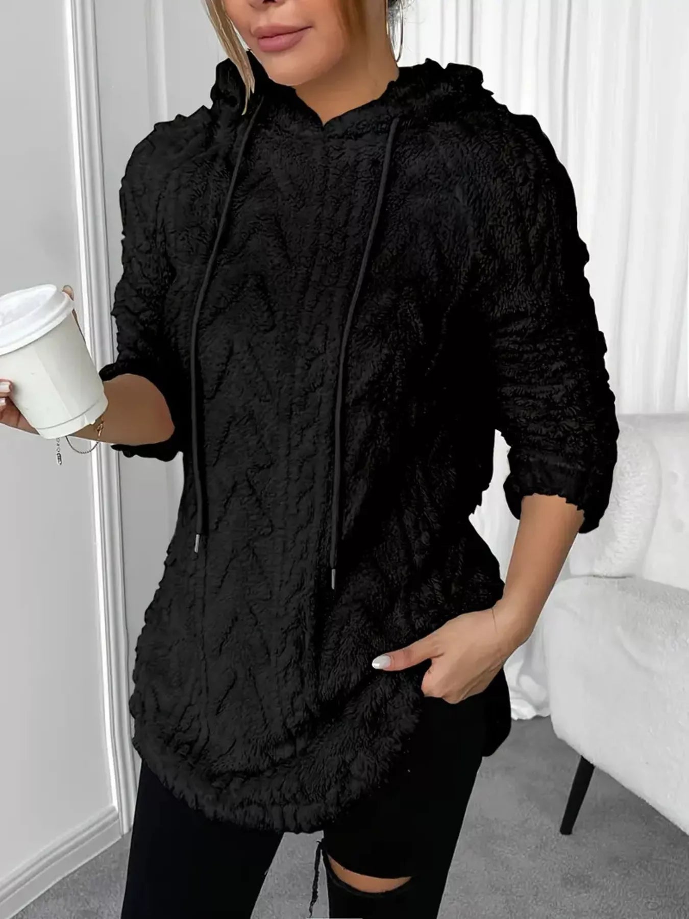 Black fuzzy hoodie sweater with drawstring hood and soft sherpa fleece fabric