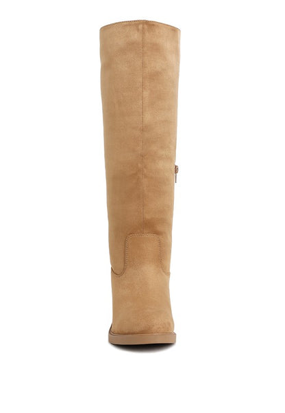 Tan suede knee-high boot with side zipper and almond toe design.
