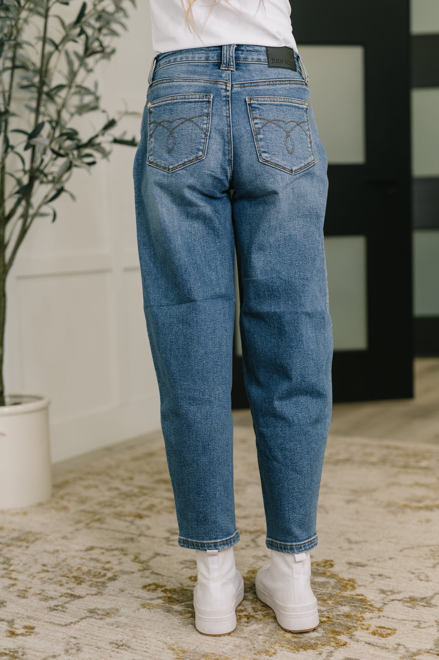 Judy Blue blue denim jeans with a relaxed fit and embroidered back pockets