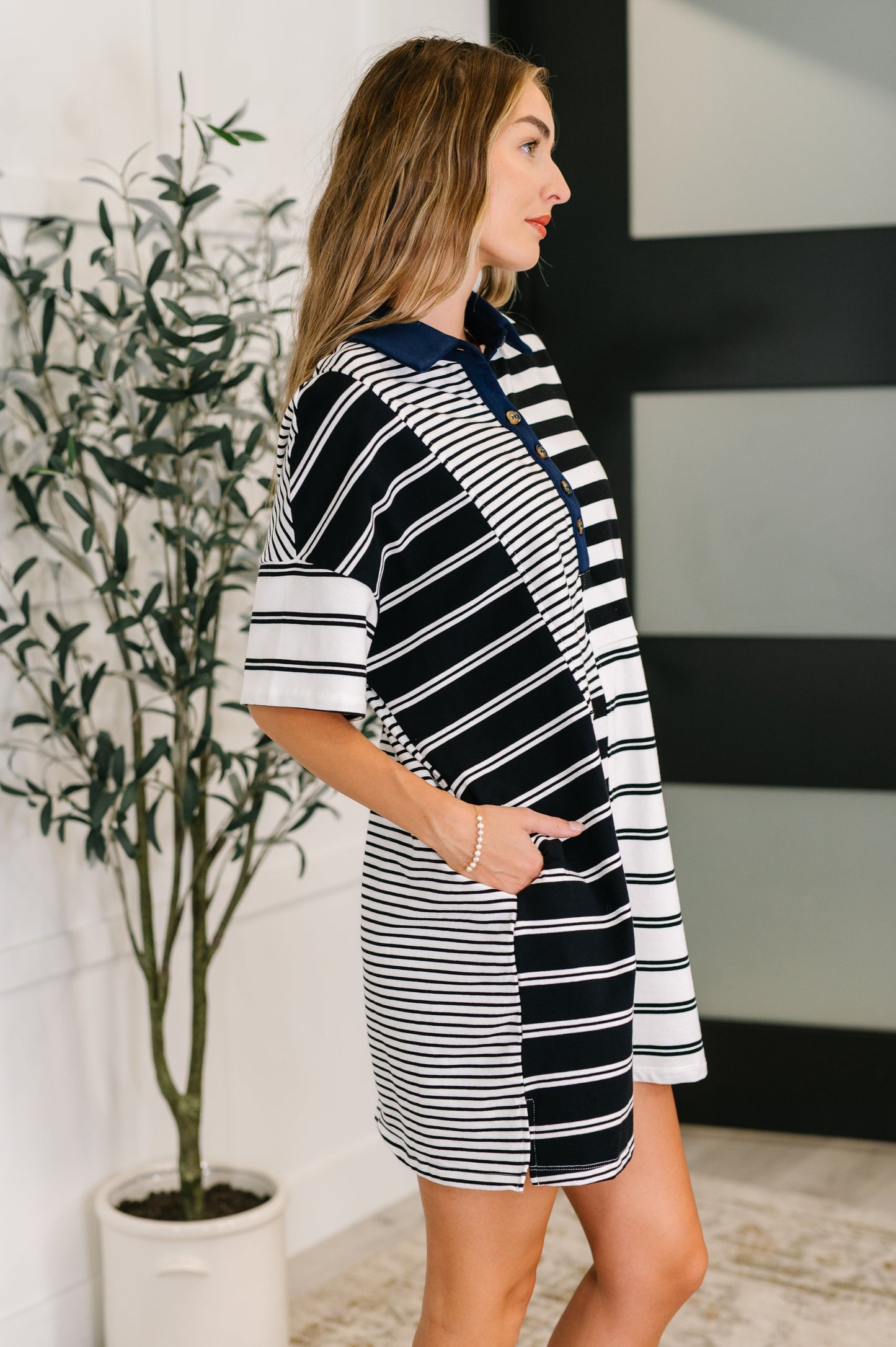 Navy and white striped polo dress with short sleeves and front buttons