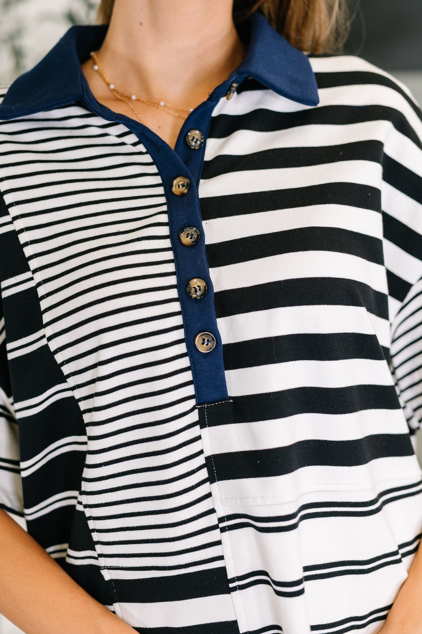 Striped Polo Shirt black and white cotton top with navy collar and contrast panel design