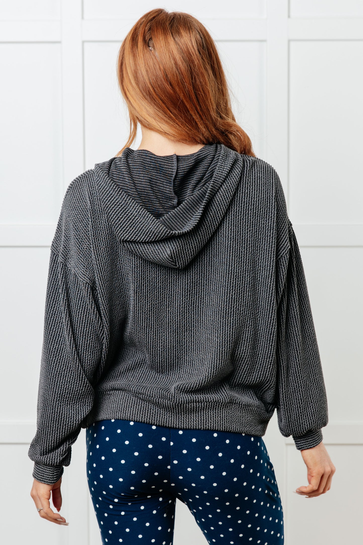 Charcoal waffle knit hoodie with drop shoulders and relaxed fit.