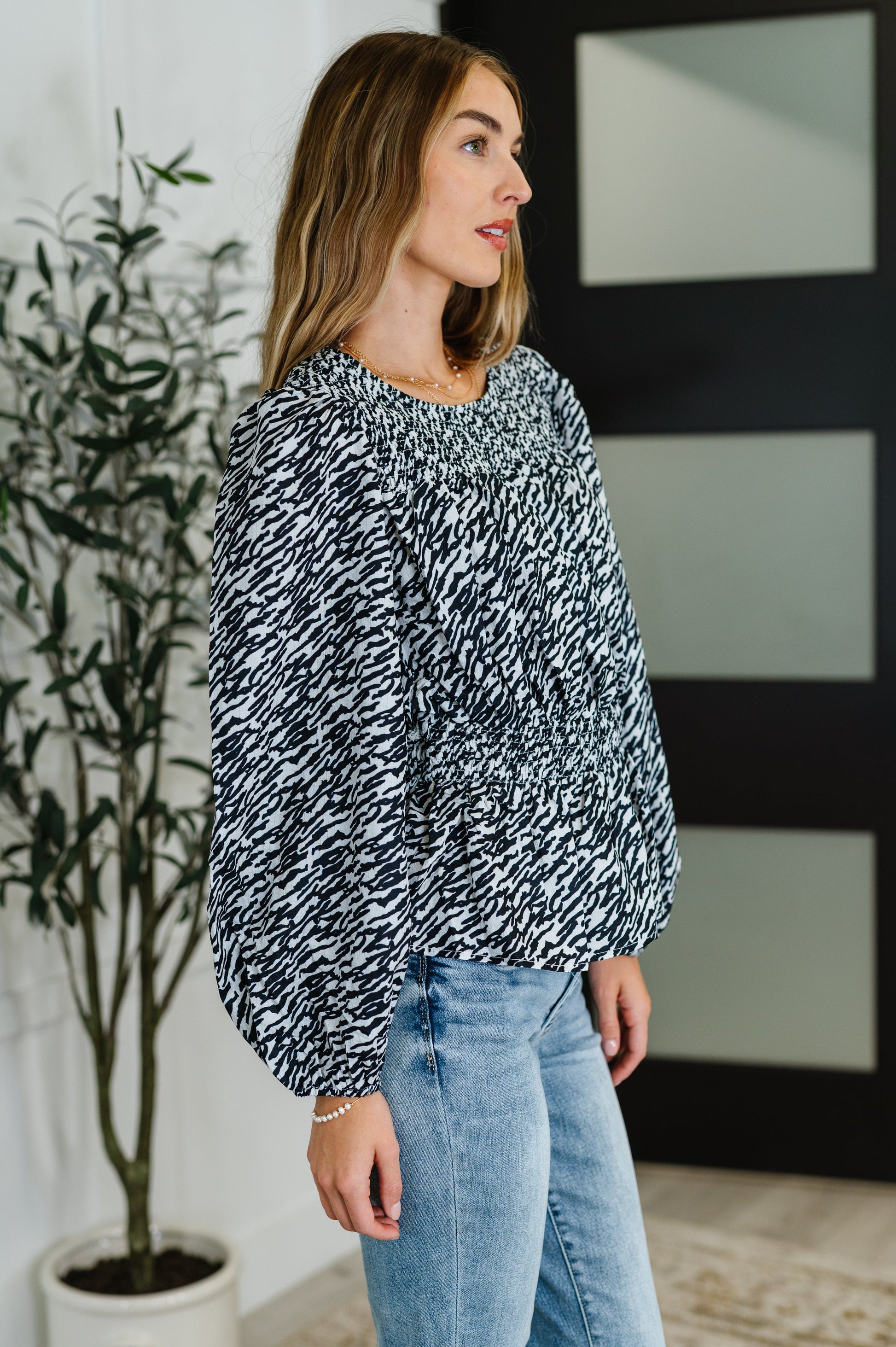 Zebra Print Smocked Blouse in black and white with long balloon sleeves and lightweight fabric.