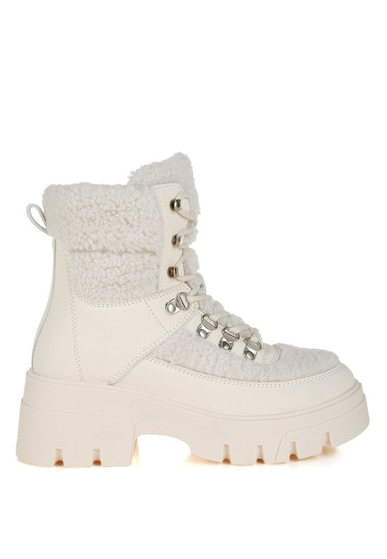 Ivory lace-up winter boot with faux shearling and chunky lug sole for added traction.