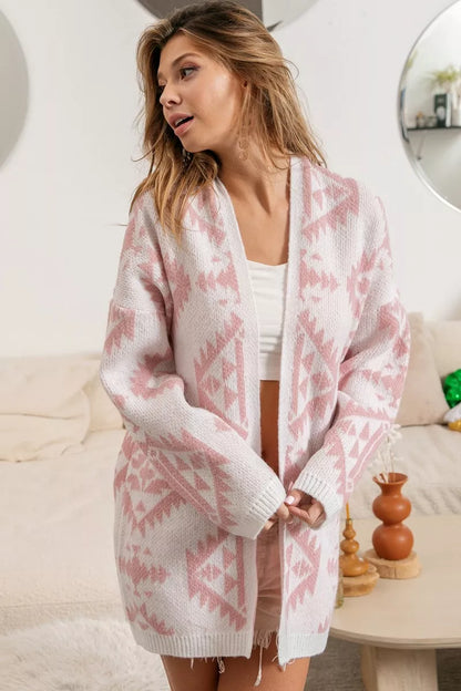 Pink and white Aztec knit cardigan with open front and soft, cozy acrylic fabric.