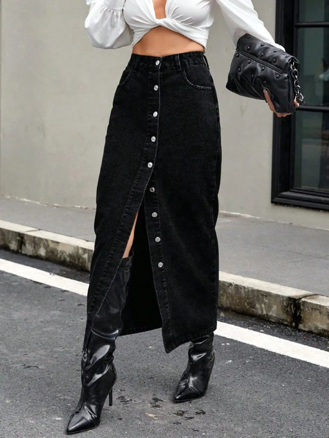 Black denim maxi skirt with front buttons and high slit detail