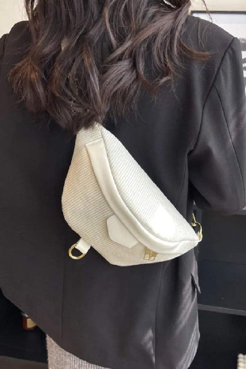 Ivory crossbody bag, textured fabric design with gold-tone hardware.