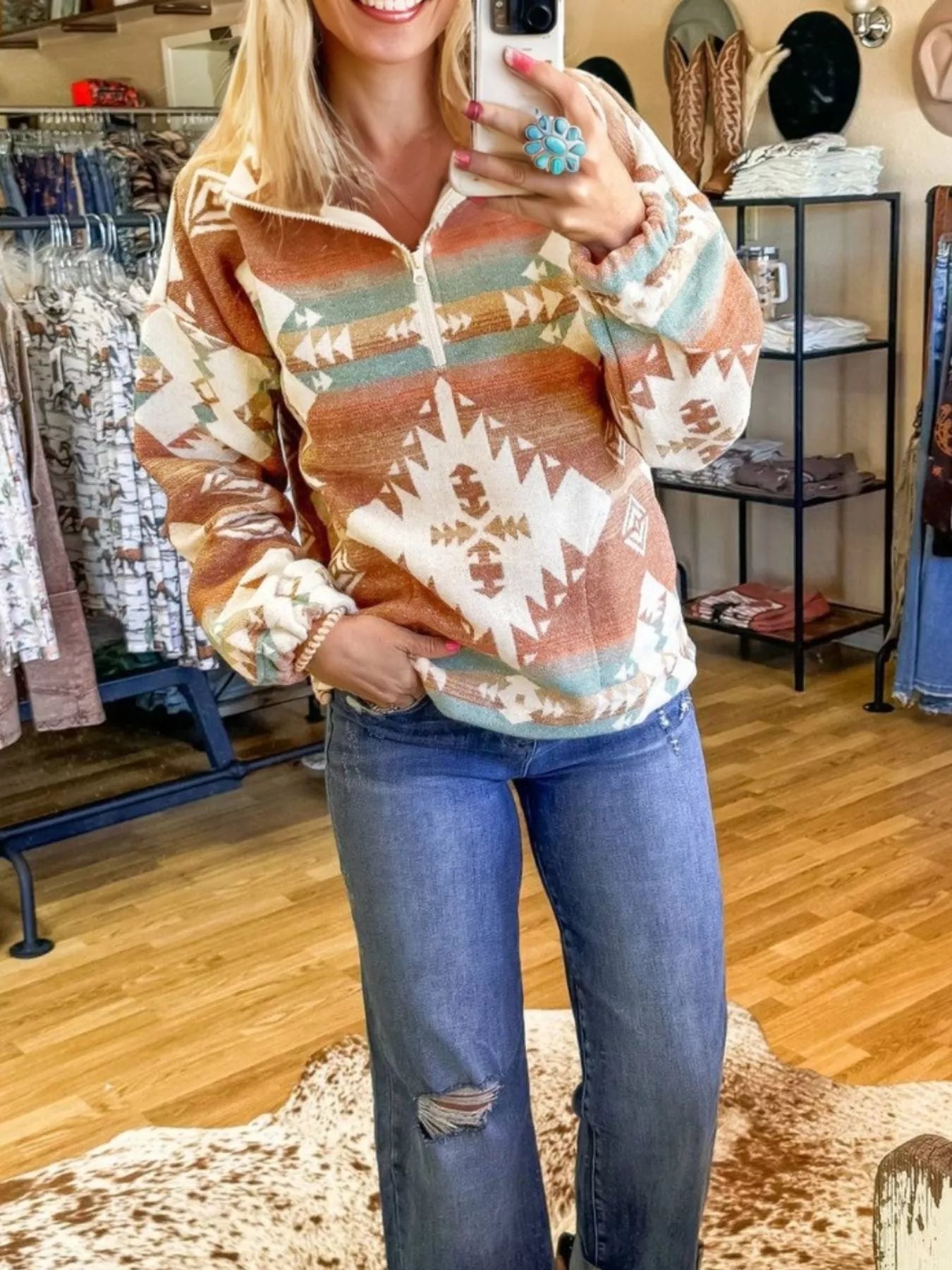 Rust Aztec Quarter-Zip Pullover, featuring a southwest pattern and soft fleece material.