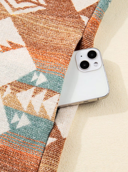 Geometric Pocket Throw Blanket, multicolor, woven textile with built-in phone pocket.