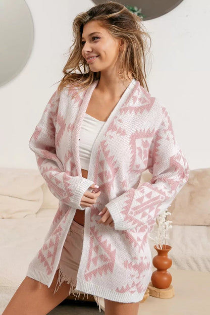 Pink Geo Knit Cardigan – White and pink open-front cardigan with geometric pattern, made of soft knit fabric.