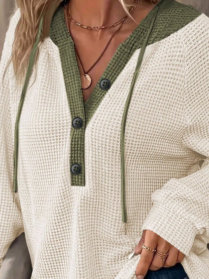 Cream and olive waffle knit pullover top with button front and drawstring neckline.