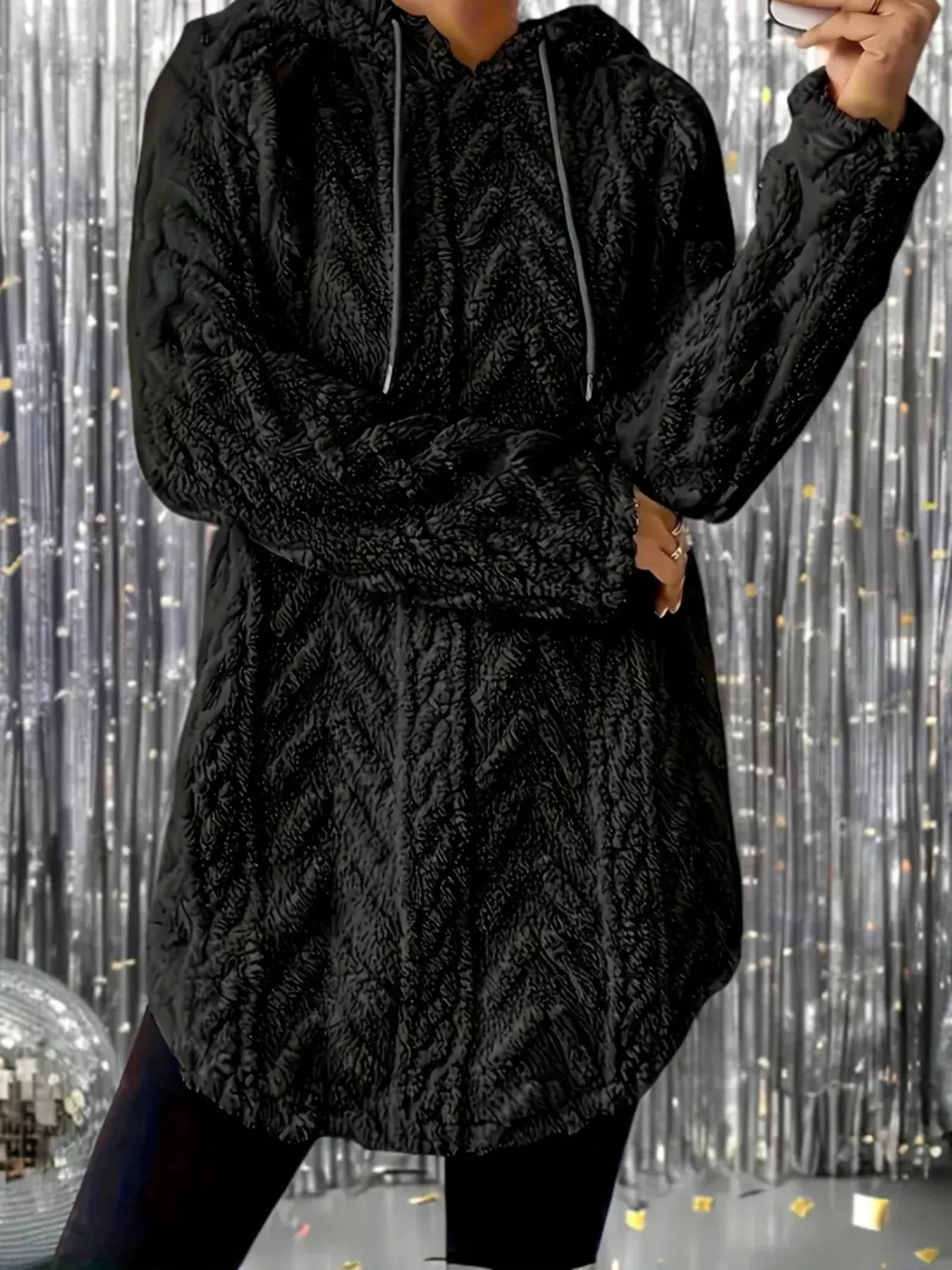 Black textured hoodie sweater with drawstrings, made from soft fleece fabric for warmth and comfort