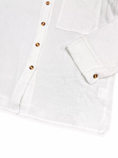White button-up shirt with tortoiseshell buttons, long sleeves, and lightweight cotton fabric.